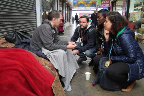 Nurses Kendra Schneller, Serina Aboim, Graeme Seccombe talk to a homeless man