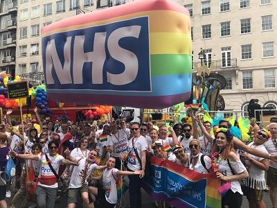 Guy's and St Thomas' staff at London Pride with NHS rainbow blimp