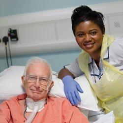 Nursing assistant with patient