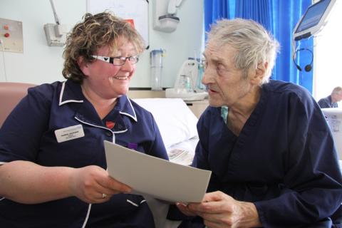 Staff Nurse Karen Jackson and Patient Alan Short talking to each other