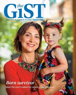 Woman holding daughter. Front cover of the GiST magazine, issue 27.